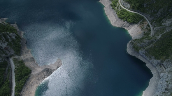Aerial View of Famous Piva Canyon with Its Fantastic Reservoir. alt