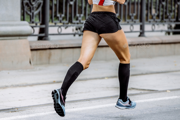 Woman Runner Legs in Compression Socks