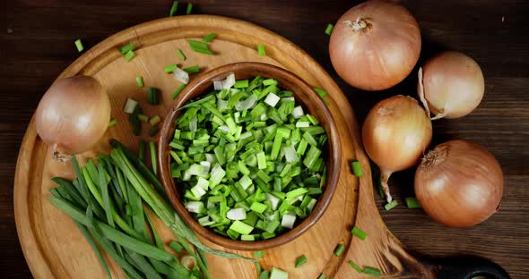 Pieces of Green Onions Fall on the Plate alt