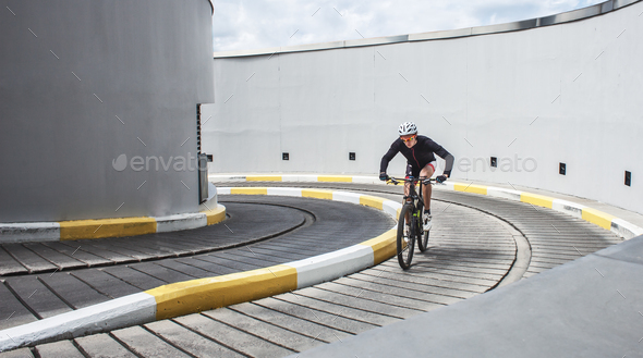 male professional cyclist ride on concrete cycle track