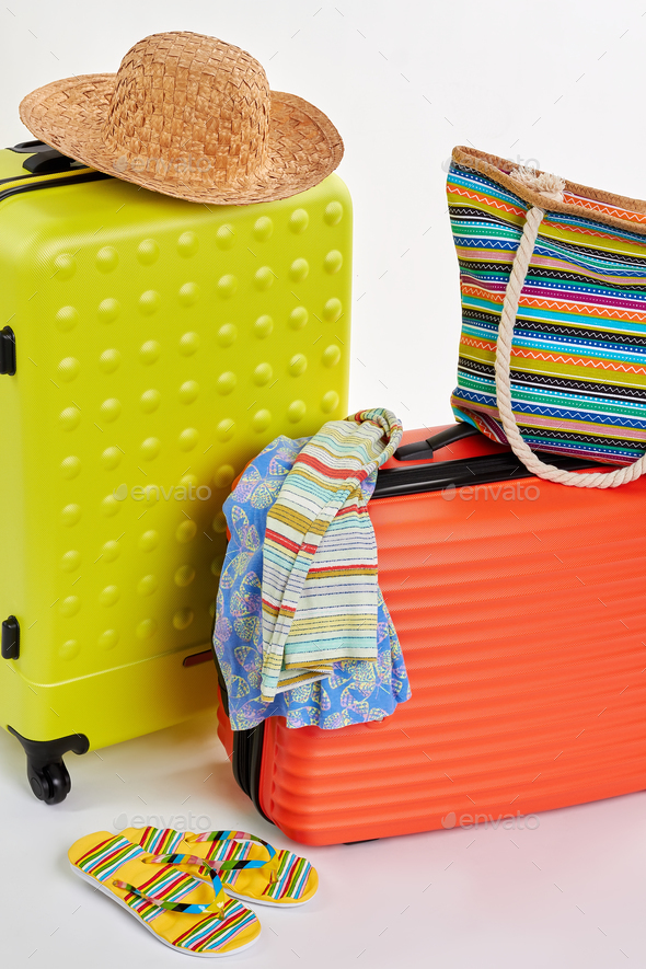 Suitcases and clothes for holiday - Stock Photo - Images