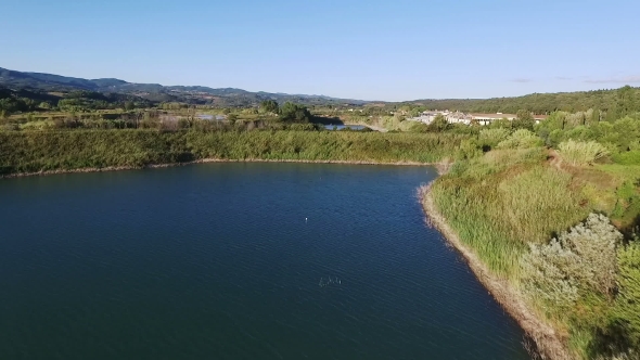 Aerial Drone Footage - Flying Over a Lake in Italy