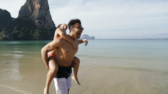 Woman Ride Man Back Turning On Beach, Happy Couple Cheerful Tourists