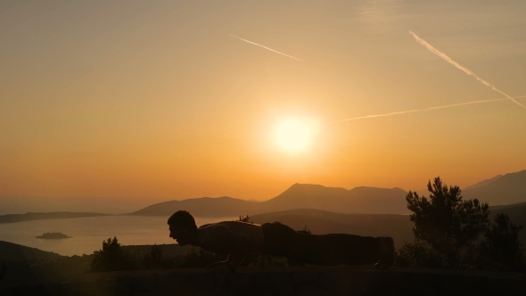 Young Man Training on Sunset