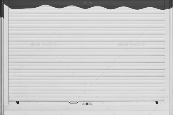 Closed and locked white rolling shutter. Security background. Horizontal  Stock Photo by ABBPhoto