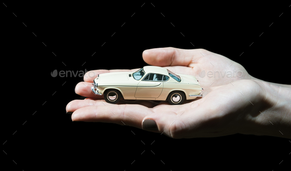 Toy car in womans hands