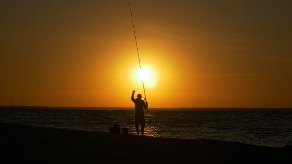 Fishing in Sea at Sunrise