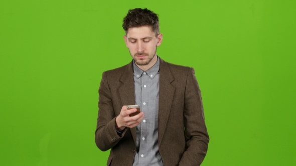 Man Dials a Familiar Number and Starts Talking. Green Screen alt