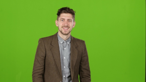 Guy Is a Businessman, Is Showing His Finger Up, Admires. Green Screen alt
