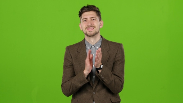 Man Admires the Performance and Claps the Actor. Green Background alt