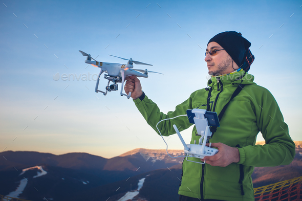 Man operating a drone - Stock Photo - Images