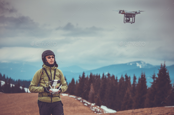 Man operating a drone - Stock Photo - Images