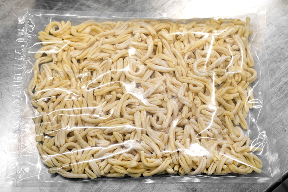 Vacuum-packed fresh Italian pasta in plastic