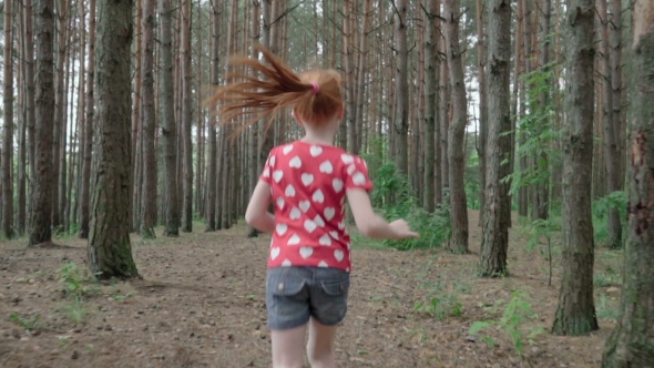 Little Ginger Girl Running in Forest