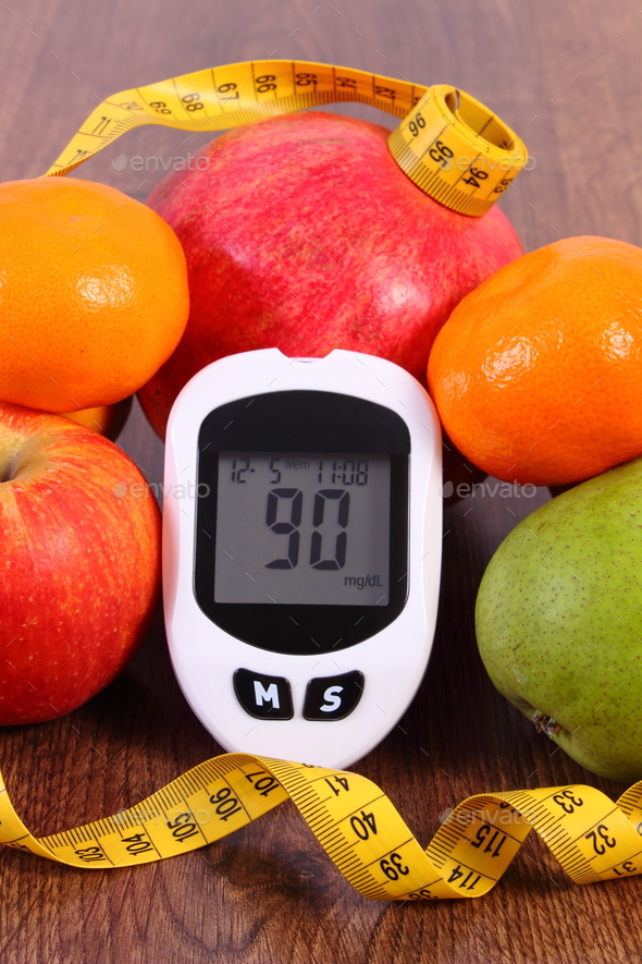 Glucometer with centimeter and fresh fruits, concept of diabetes and healthy nutrition