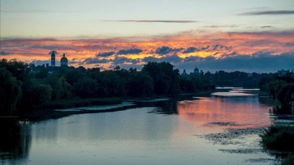 Orthodox Church Near the River and Cloudy Sky
