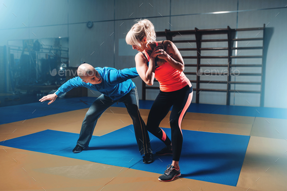 Woman in actoin on self-defense training