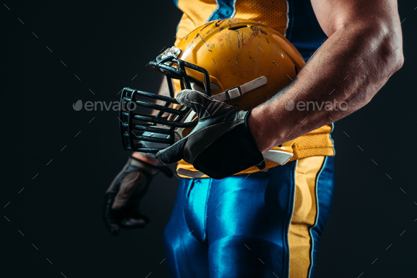 Player with american football helmet in hand - Stock Photo - Images