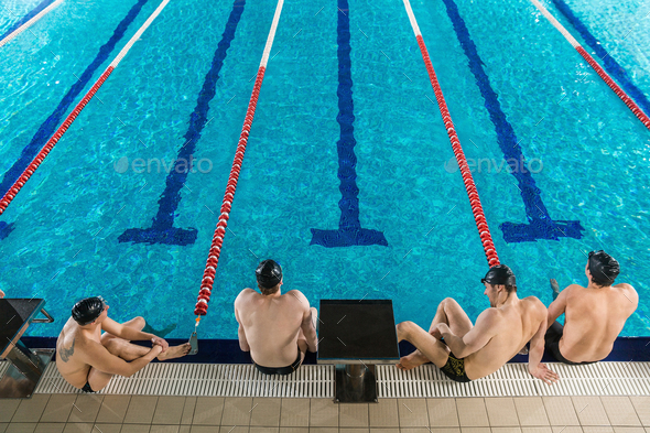 Top view of four male swimmers