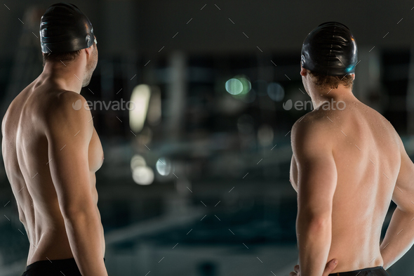 Rear view of two male swimmers