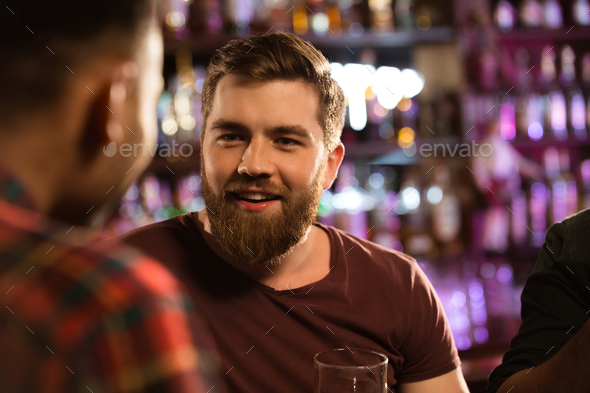 Close up of a two male friends drinking draft beer