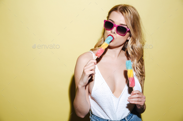 Young woman with bright lips makeup with ice cream