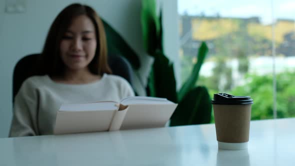 A young asian woman reading book