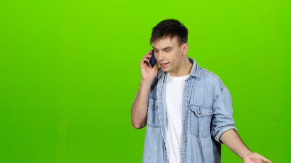 Man Dials a Familiar Number and Starts Talking. Green Screen alt