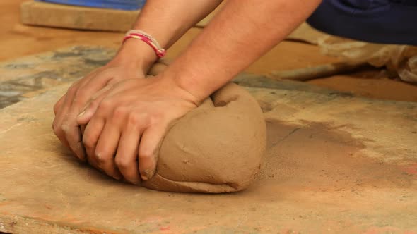 Potter at Work Makes Ceramic Dishes alt