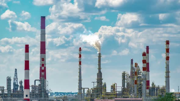 Working Process of the Oil Refinery Industry Plant with Cloudy Sky alt