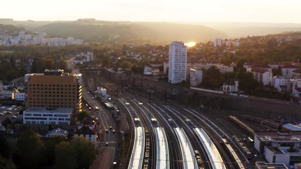 Train Station and Highspeed commuter rail tracks during gold hour drone HD 30p alt