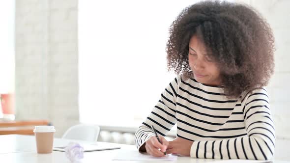 Woman Trying To Write on Paper  alt