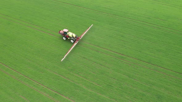 Aerial Footage of Tractor Fertilizing with Chemicals a Green ...