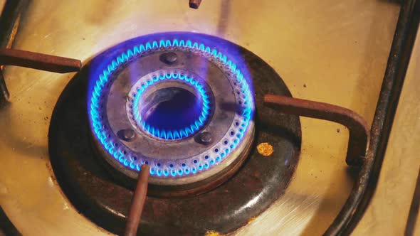 Gas on light fire burns