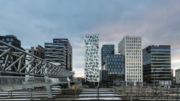 Akrobaten Pedestrian Bridge And Barcode Project In Downtown Oslo, Norway. Day To Night Cityscape Vie alt