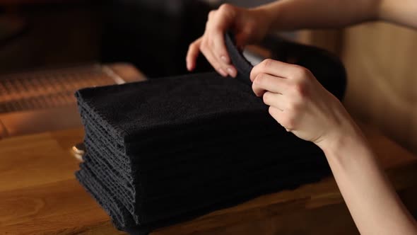 Housewife Woman Touch a Stack of Fresh Washed Clean Linen with Her Hands