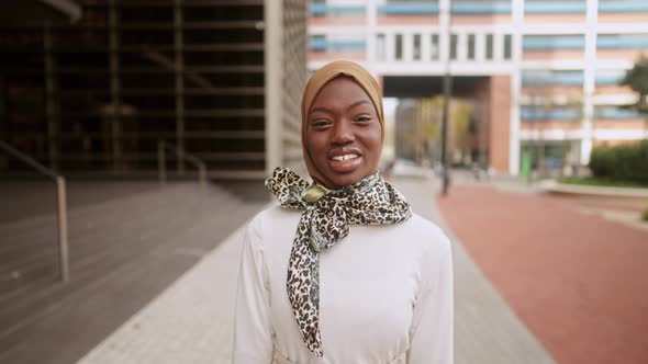 Stylish Muslim Woman Smiling for Camera alt