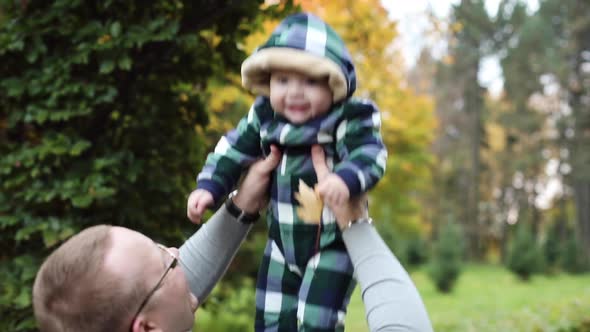 Baby Laughing While Father Throwing Up and Catching Child