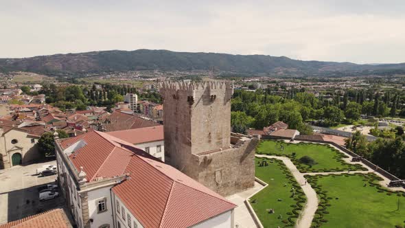 Orbital shot of castle tower, museum and garden in Chaves, Portugal alt