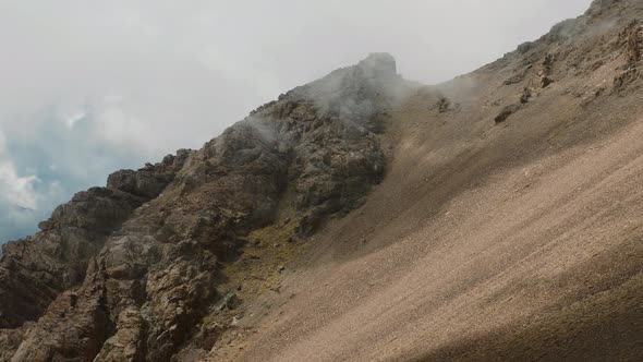 Clouds moving fast over high altitude mountain in High Atlas, Morocco, static alt