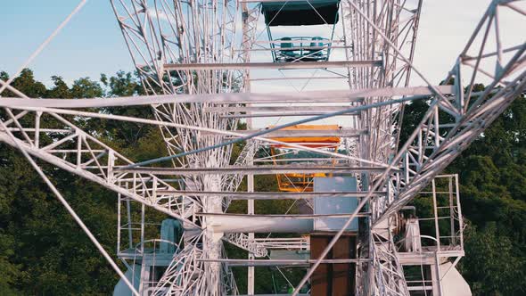 Mechanism of a Rotating Old Metal Ferris Wheel View From Inside the Cabin alt