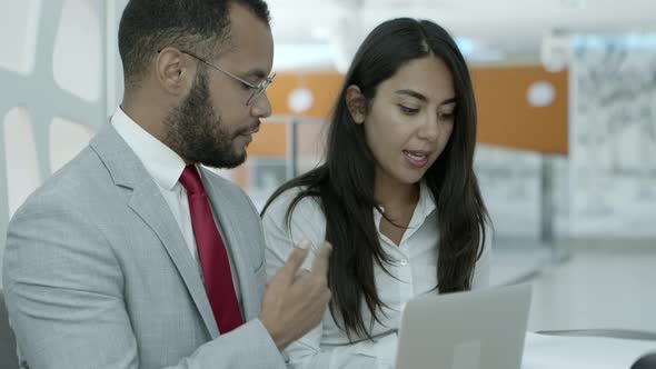 Business Colleagues with Laptop and Papers by kampus_video | VideoHive