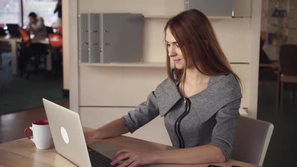 Businesswoman Throughs with Project Close Laptop and Enjoy Cup of Tea alt