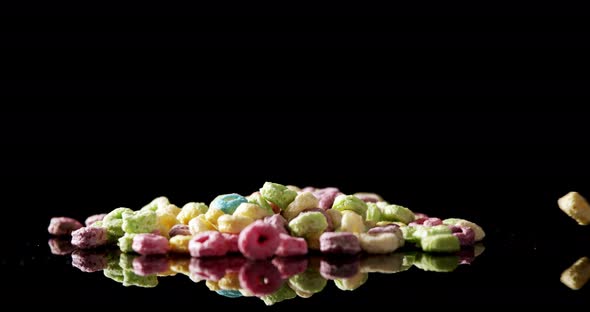 Froot loops on black background 4k alt