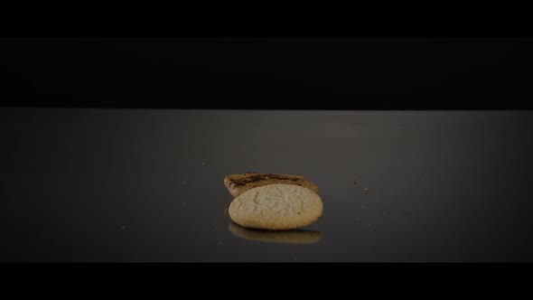 Falling cookies from above onto a reflective surface - COOKIES 240 alt