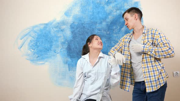 Young Woman Talks to Boyfriend Discussing Apartment Interior alt