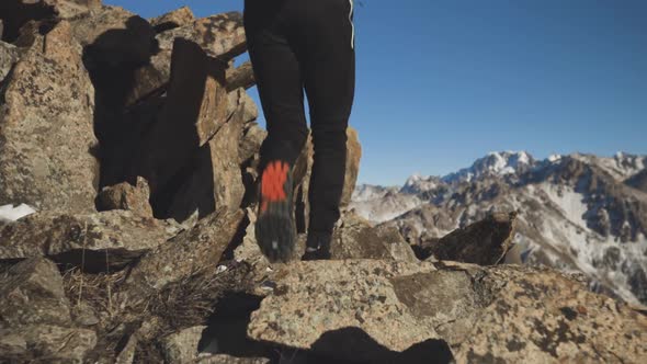 Man Running at the Mountain with Snow alt