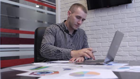 Businessman Analyzing Graphs alt