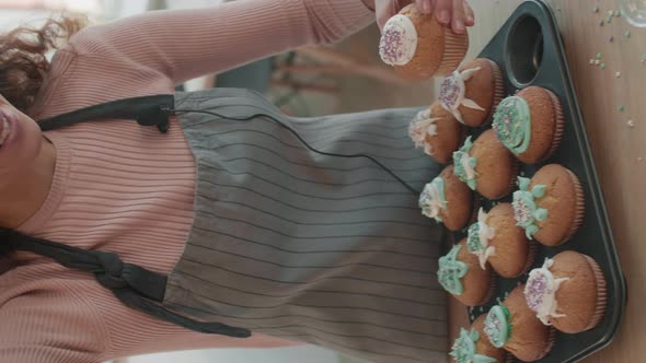 Happy Woman Posing with Cupcake alt