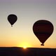 2 hot air balloons at sunrise in Cappadocia, Turkey seen from another ballon